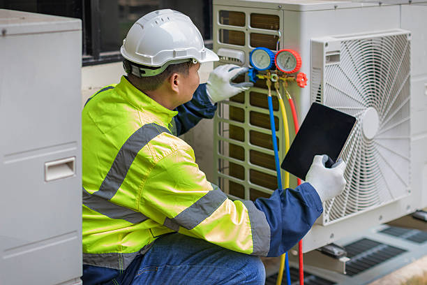 Professional Emergency Ac Repair technician working in Washburn, WI
